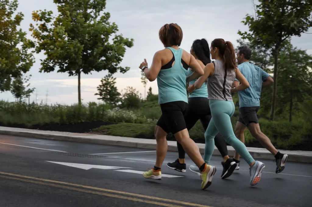 A group of vegetarian runners training together in a park, highlighting community and shared lifestyle choices.